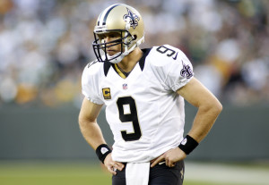 New Orleans Saints quarterback Drew Brees pauses during a time out against the Green Bay Packers in the second half during their NFL football game in Green Bay, Wisconsin